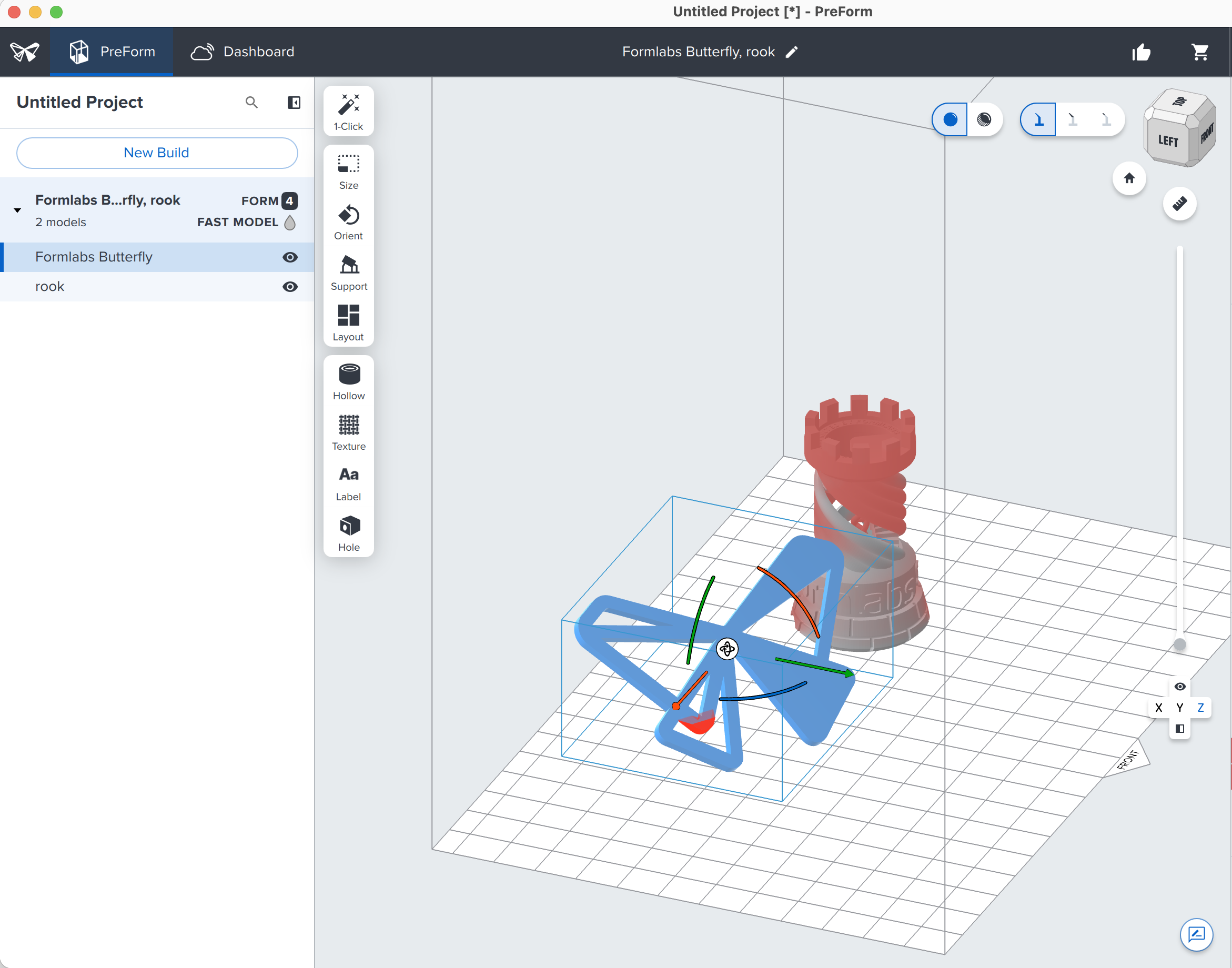 The PreForm window with two models on the build platform, one of them selected.